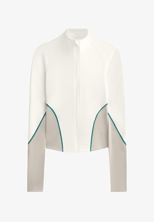 Veste blanche zippée avec manches longues, présentant des panneaux latéraux gris et des accents bleu canard le long des coutures. Tissu lisse avec un design ajusté.