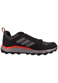 Black athletic shoe with gray accents, mesh upper, red highlights, durable sole, and a pull tab at the heel for easy wear.