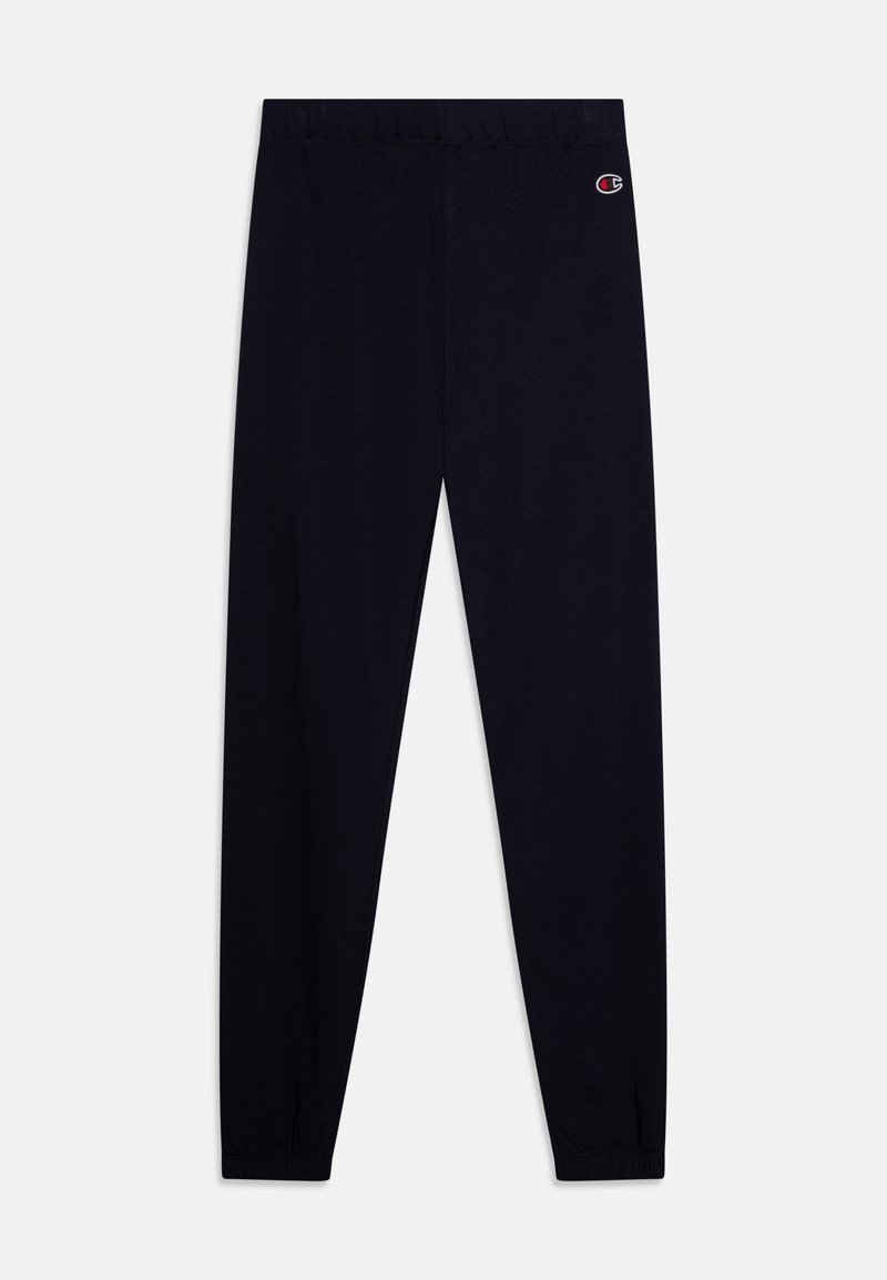 Joggers navy con vita elastica, gambe affusolate e polsini arricciati. Presentano una piccola patch con logo sulla parte superiore della gamba sinistra.
