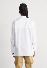 The North Face HIGH LOW - Pogājama blūze - white