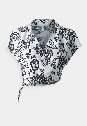 Black and white floral-patterned cropped wrap top with short sleeves and a v-neckline, made from lightweight fabric. Features a tie closure.