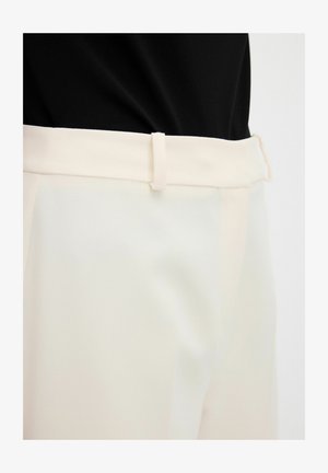 Beige trousers with a smooth texture, featuring a flat waistband and belt loops. The fabric appears lightweight and slightly glossy.