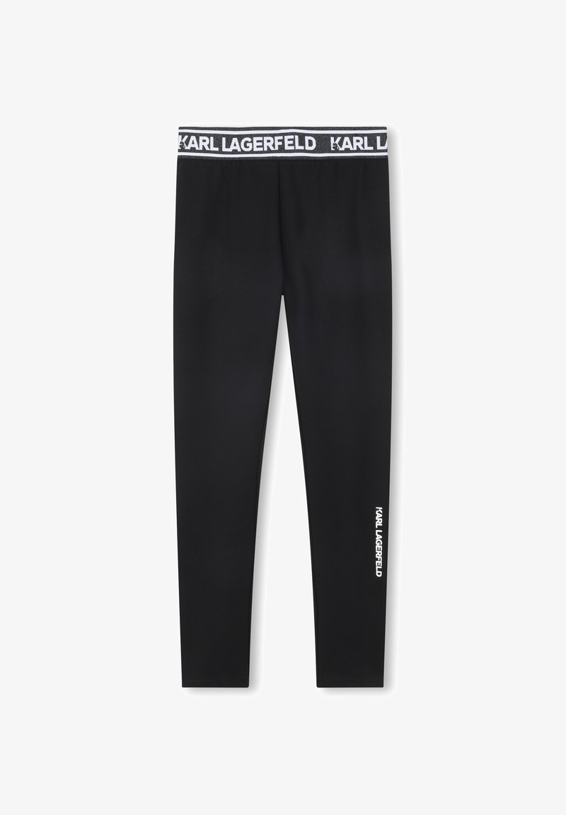 Leggings noirs slim avec "KARL LAGERFELD" imprimé sur la ceinture et verticalement sur la partie inférieure de la jambe en lettres blanches.