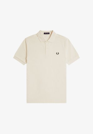 Polo beige à manches courtes avec col, deux boutons et petit logo laurier noir brodé sur la poitrine gauche.
