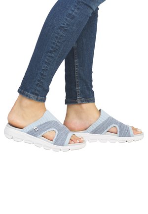 Light blue slide sandals with a textured knit upper and white flexible sole. Open-toe design features a strap across the foot for support.