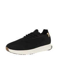 Svart idrottssko med ett andningsbart stickat ovandel, rund tå, snörning, vit mellansula och beige gummiutsula. Har en logotypdetalj.