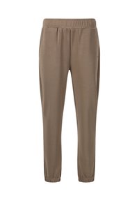 Lichtbruine sportbroek met een elastische tailleband en taps toelopende benen. Zacht materiaal met minimale details, waaronder gathered boorden bij de enkels.
