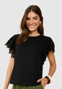 FLUTTER - Triko s potiskem - black