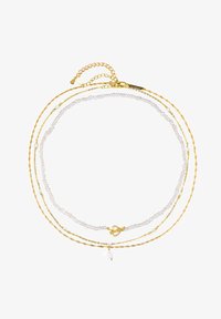 Niewybrane, gold-coloured