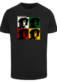 Black cotton t-shirt featuring a square design with four colored panels (green, red, yellow, and black) and repeated graphic of a man’s face.