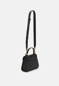 Black leather handbag with a structured shape, featuring a top handle and an adjustable strap. Gold hardware accents and a smooth texture.