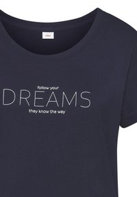 Navy blue cotton t-shirt featuring a round neck and short sleeves. Text design reads "follow your DREAMS they know the way" in white.