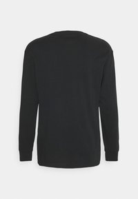 Langärmliges schwarzes T-Shirt aus Baumwolle mit Rundhalsausschnitt, geradem Schnitt und einfarbigem Design, ohne sichtbare Muster oder Akzente.