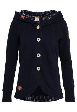 Veste à capuche bleu marine avec quatre boutons en bois, manches longues, ourlet avant arrondi et doublure intérieure à motifs avec petits points blancs et formes.