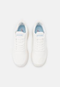 White athletic sneakers with a textured mesh upper, flat laces, and a light blue insole. Features the brand logo on the tongue.