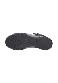 Schwarze Schuhsohle mit strukturiertem Gummimuster für besseren Halt. Verfügt über kreisförmige erhabene Akzente und ein tiefes Profil für Stabilität auf verschiedenen Oberflächen.