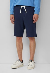 Navyblauwe katoenen shorts met een elastische tailleband en witte trekkoord. Heeft een relaxte pasvorm en zijzakken, eindigt net boven de knie.