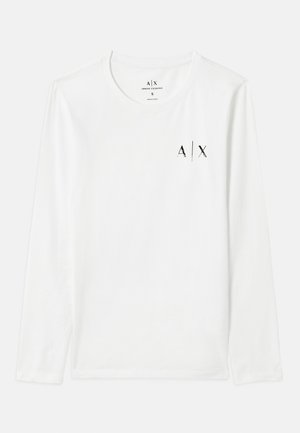 Hvit langermet skjorte med rund hals, med en liten svart trykt logo 'A/X' på brystet. Glatt stoff og klassisk snitt.