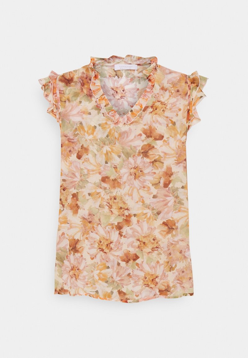 Blouse florale avec manches courtes à volants, col en V, dans des tons pastel de pêche, rose et vert. Tissu léger et transparent avec un motif floral.