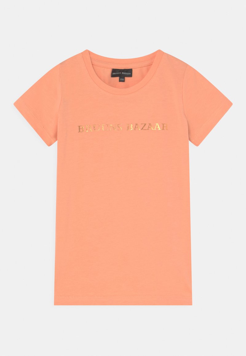 T-shirt de manga curta na cor pêssego, com um logótipo em folha de ouro "BRUINS BAZAAR" na frente. Feita de um tecido suave e leve.
