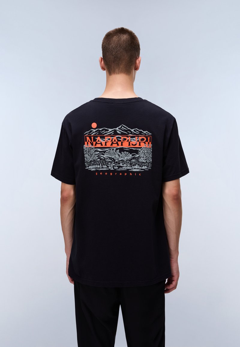 Black cotton t-shirt with a graphic print depicting mountains, trees, and a sun in orange. Text reads "NAPAPIJRI" and "geographic."