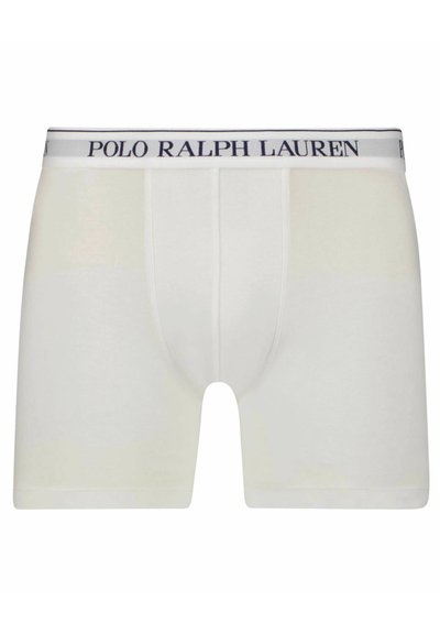 Vita boxer-shorts i mjuk bomull, med en åtsittande passform och en midjeresår med texten "POLO RALPH LAUREN" i marinblå bokstäver.