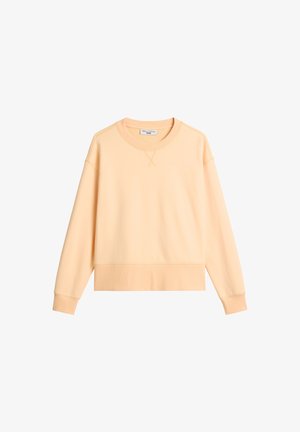 Felpa color pesca con maniche lunghe, polsini e orlo a coste. Presenta una scollatura tonda e dettagli a punto croce sul collo. Realizzata in tessuto misto cotone.