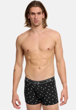 Schwarze Boxershorts aus weichem Stoff mit einem weißen Paisley-Muster. Mit einer engen Passform und einem elastischen Bund, der mit "DIM" beschriftet ist.