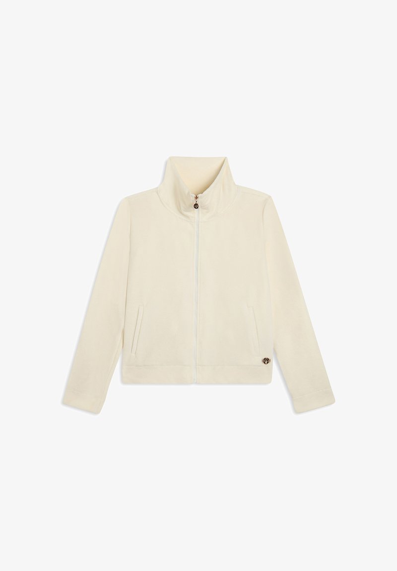 Giacca in fleece color crema con colletto alto, zip frontale, due tasche laterali e logo sulla parte inferiore sinistra. Tessuto morbido, vestibilità rilassata.