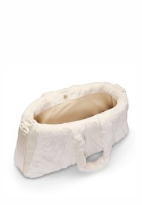 Biała pluszowa torba transportowa dla zwierząt z miękkim wnętrzem, owalnym kształcie, teksturowanym zewnętrzu i krótkich uchwytach. Zapięcia widoczne po bokach.