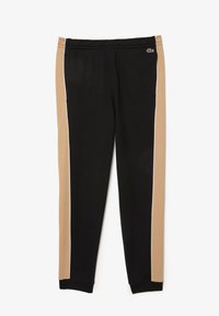 Pantalons de survêtement noirs avec des rayures latérales marron clair et une garniture blanche. Taille élastique et poignets élastiques. Le matériau semble lisse et durable.