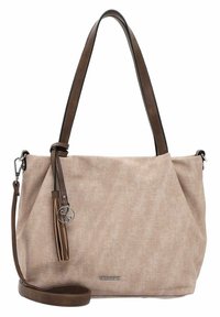 Sac à main en toile beige avec des poignées et des accents en cuir marron. Il dispose d'un détail en pompon et d'une plaque de logo argentée à l'avant.