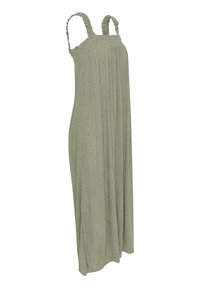 Robes sans manches vert clair avec des bretelles volantes, un corsage froncé et une coupe fluide et ample. Présente un tissu texturé et des détails subtils.