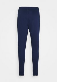 Marineblauwe slim-fit joggers van een zachte katoenmix, met een elastische tailleband en taps toelopende pijpen. Geen zakken of versieringen.