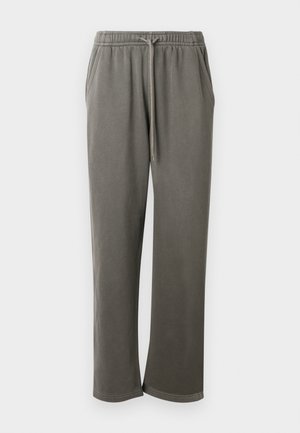 Pantalon de survêtement en coton gris avec une taille élastique et un cordon de serrage, doté de poches latérales et d'une coupe décontractée sur les jambes.