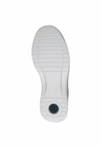 Vit skosula med vertikala och horisontella spår, runt mörkgrått logotyp, texturerad yta för grepp och formad klackdesign.