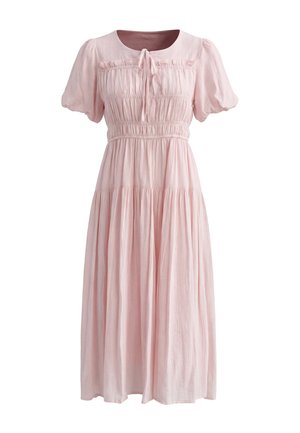 Light pink midi dress with short puff sleeves, gathered waist, ruched bodice, and a small bow tie at the round neckline.