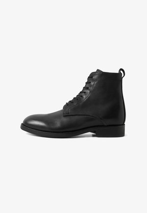 Black leather ankle boot with laces, rounded toe, low heel, and pull tab at back, shown in side profile on white background.