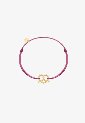 Bracelet ajustable avec une corde rose et un centre en métal doré en forme de cœur, agrémenté de petites perles.