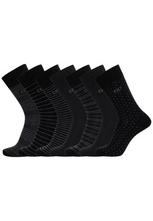 Set aus sieben schwarzen Socken mit verschiedenen Mustern: feine Streifen, einfarbig und gepunktet. Aus weichem Stoff hergestellt; mittellange Knöchelhöhe.