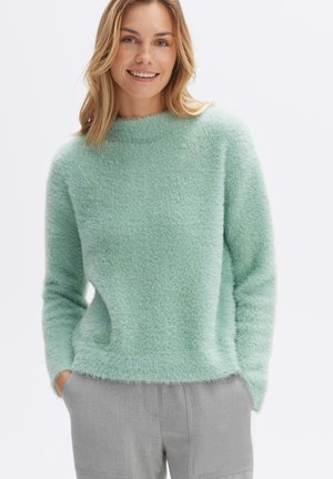 Mint green, fluffy knitted sweater with a high neck and long sleeves. It has a relaxed fit and a soft, textured appearance.
