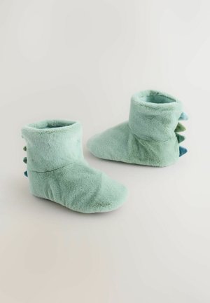 Weiche, mintgrüne Plüsch-Booties mit einem umgeschlagenen Bündchen, das im Rücken mit strukturierten Dornen in Dunkelblau und Grün verziert ist. Glatte Oberfläche.