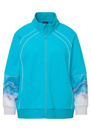 Turkis zip-up jakke med hvide accenter, der har mønstrede ærmer, der ligner agat. Fremstillet af blødt, tekstureret stof.