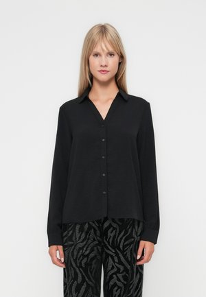 Black long-sleeve blouse with a v-neck, button closure, and textured fabric. Features a relaxed fit with cuffs at the wrists.