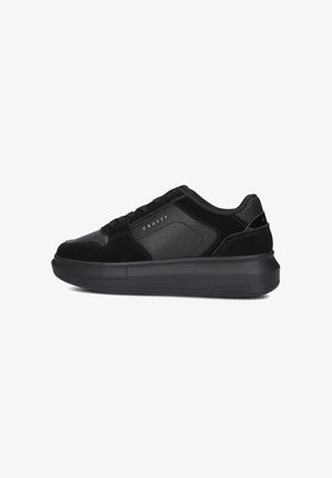 Black sneakers with a combination of smooth leather and suede. Features a rounded toe, padded collar, and a textured panel on the heel.