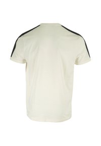 Camiseta de manga corta en algodón color blanco roto con detalles en negro en los hombros y un cuello redondo. Textura suave con un corte recto.