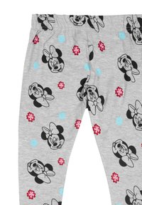 Leggings grigi con un motivo a tutto campo di facce di Minnie Mouse nere e fiori colorati con accenti rosa e blu. Tessuto morbido, cintura elastica.