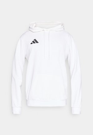 Λευκή φούτερ με κουκούλα και τσέπη καγκουρό, ρυθμιζόμενο κορδόνι κουκούλας και μαύρο λογότυπο με τρεις ρίγες στο αριστερό στήθος. Μαλακή υφή υφάσματος.