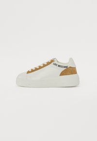 White leather sneakers with a tan suede accent, round toe, flat rubber sole, and "LOVE MOSCHINO" branding on the side.