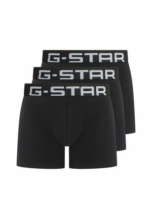 Drei schwarze Boxer-Briefs für Herren mit breiten elastischen Bündchen, die den Markennamen "G-STAR" in fetten weißen Buchstaben zeigen.